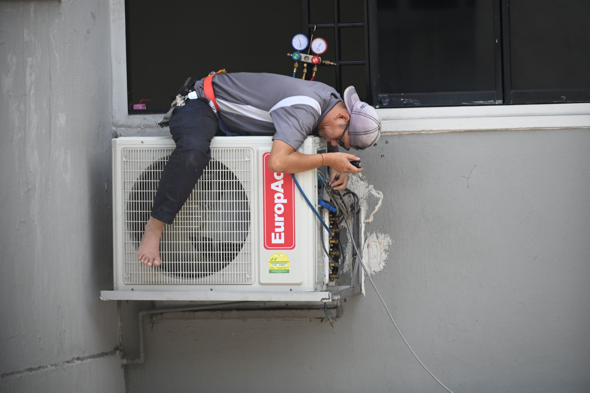 An HVAC technician on a service call