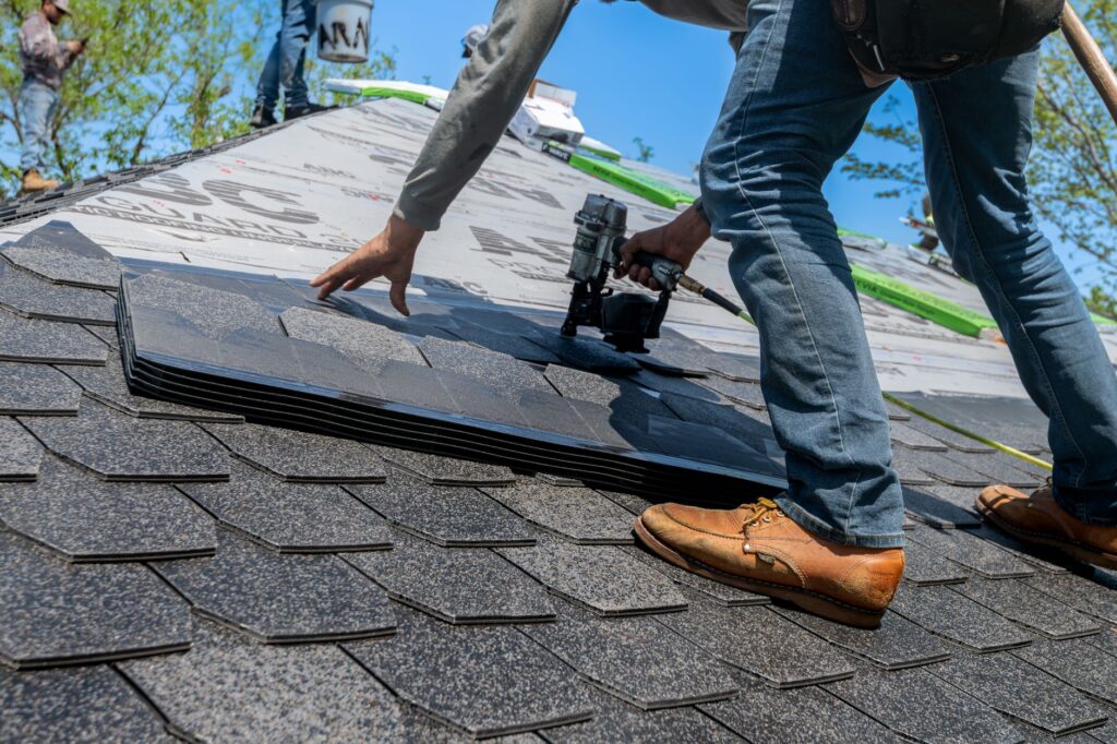 A roofer at work on an American home