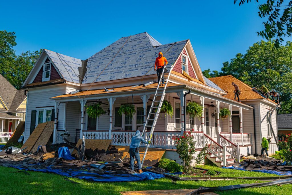 A roofing crew replacing a roof